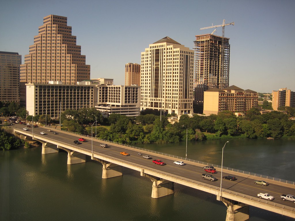 The Congress Avenue Bridge over Lady Bird Lake, with the downtown Austin skyline behind it